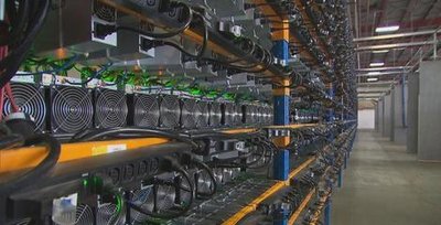 A modern crypto mining farm with advanced cooling systems.